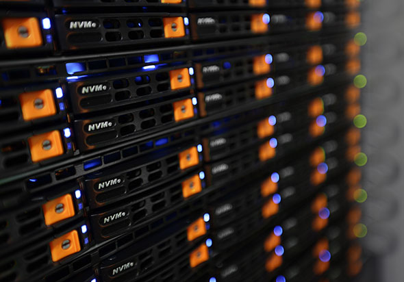 DCX Data Centers closeup of server with orange and blue lights